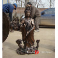 bronze kuan yin statue standing on dragon sculpture